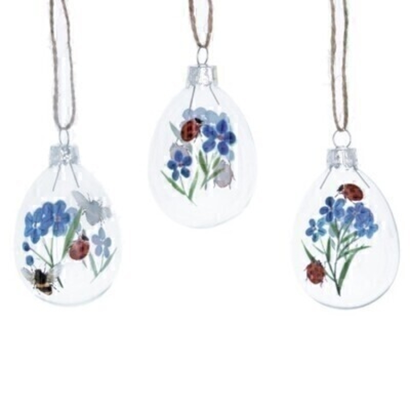 If you are looking for some Easter decorations for your Easter Tree then be sure not to miss these cute glass Easter Eggs decorated with blue forget-me-not flowers ladybirds and bees. These hanging decorations are made by designer Gisela Graham. Choice of 3 available (please specify when ordering which one you would like) If three are ordered we will send you one of each design. Comes complete with string to hang on your Easter Tree and makes a lovely Easter Hanging Decoration.